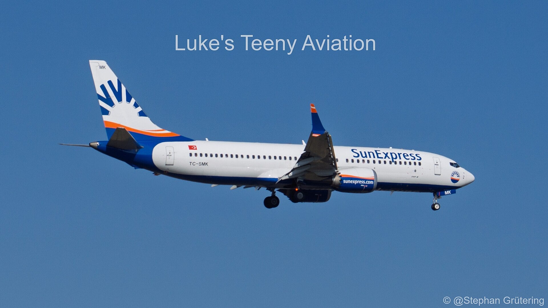 SunExpress Boeing 737 MAX 8 TC-SMK on approach showing split-tip winglets and chevron engine nacelles