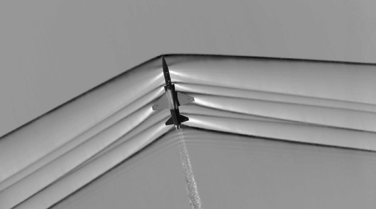 Shock waves around a supersonic T-38 captured by NASA air-to-air schlieren photography