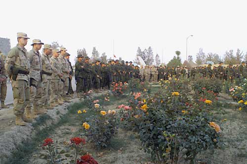 Soldiers standing in formation at a memorial service at Kandahar in 2002