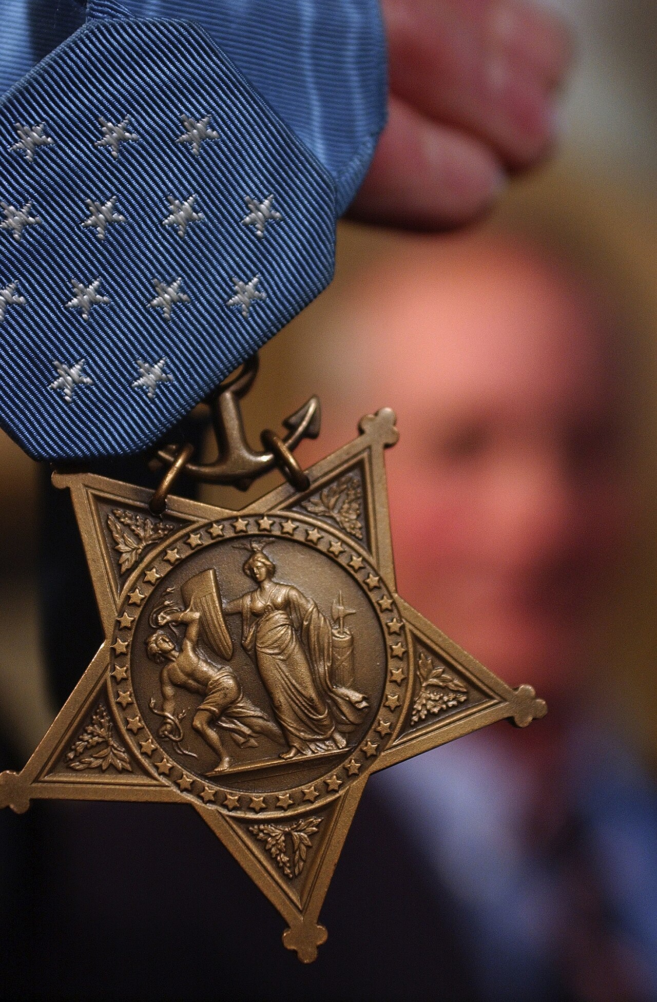 Thomas Norris holds his Medal of Honor