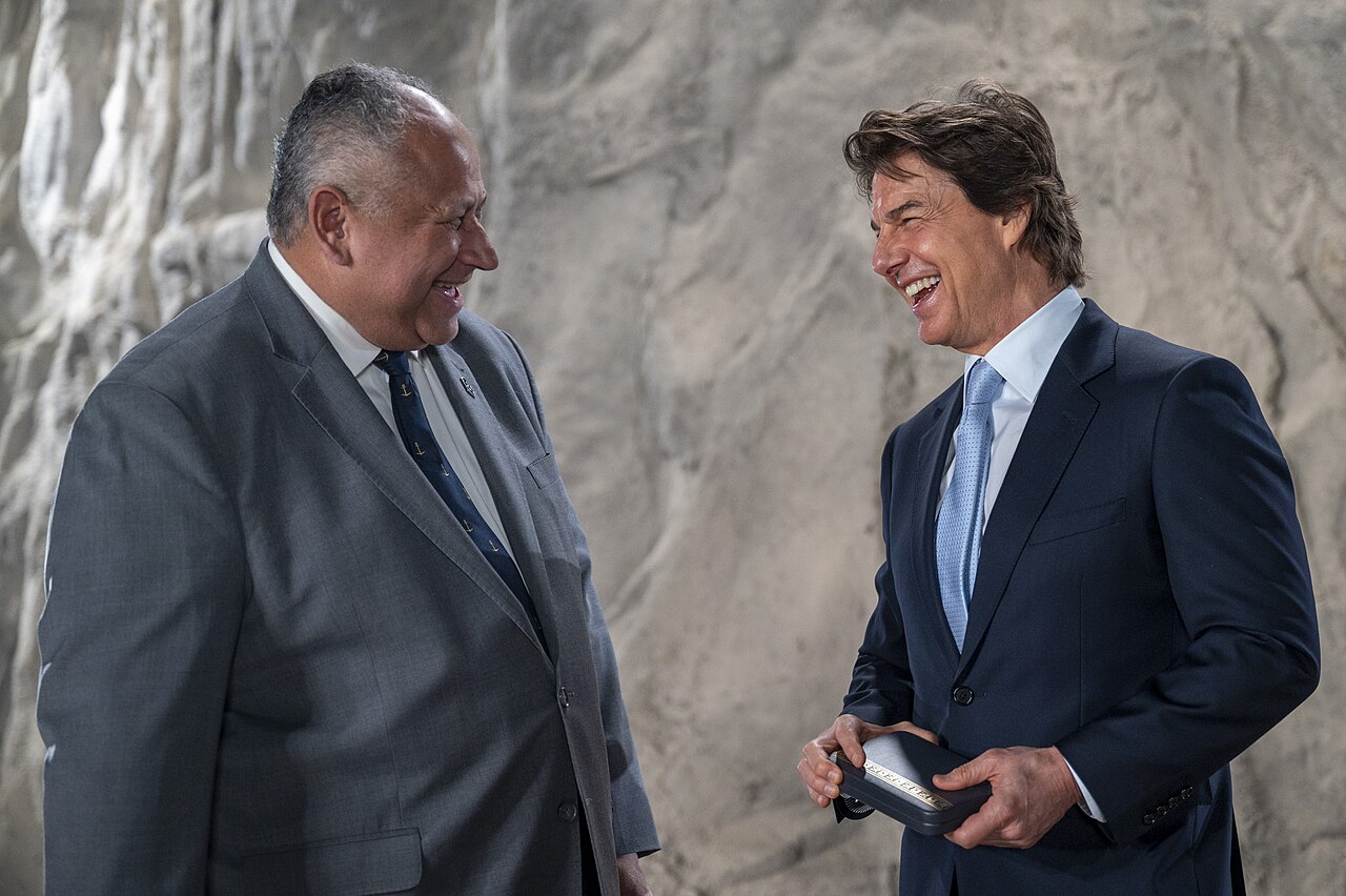 Navy Secretary Carlos Del Toro presents Tom Cruise with the Distinguished Public Service Award in December 2024
