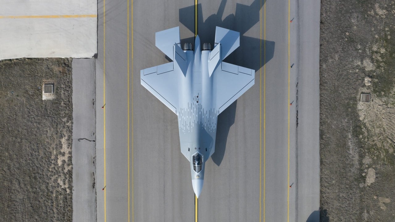 Overhead view of the TUSAŞ KAAN P1 fighter prototype on a runway during ground tests