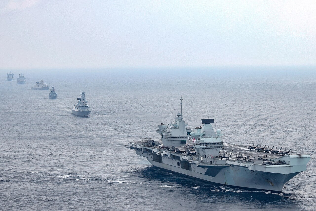 HMS Queen Elizabeth leading the UK Carrier Strike Group with destroyer, frigates and RFA tankers in line behind her