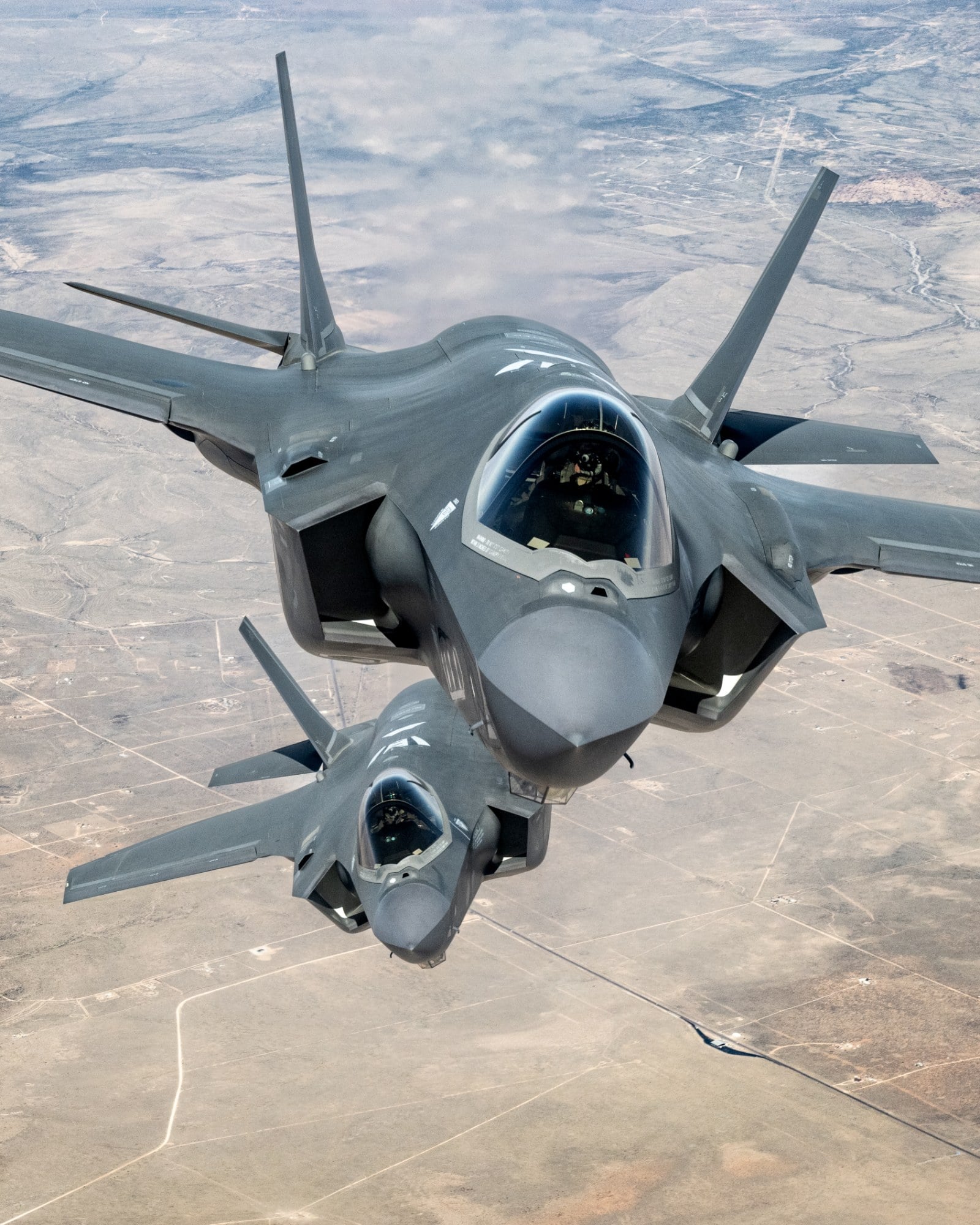 Two U.S. Air Force F-35A Lightning II fighters flying in close formation over Arizona