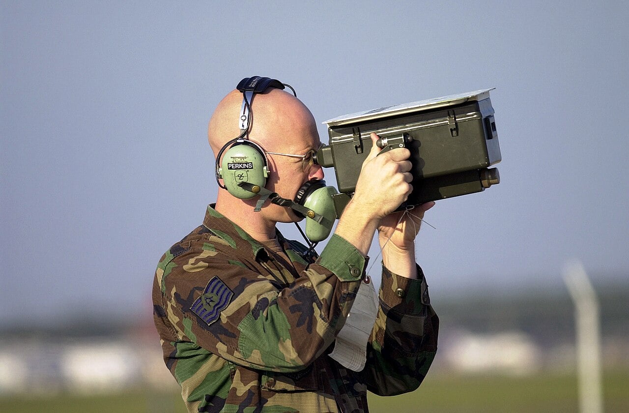 A US Air National Guard avionics technician checking an aircraft transponder with an IFF test set