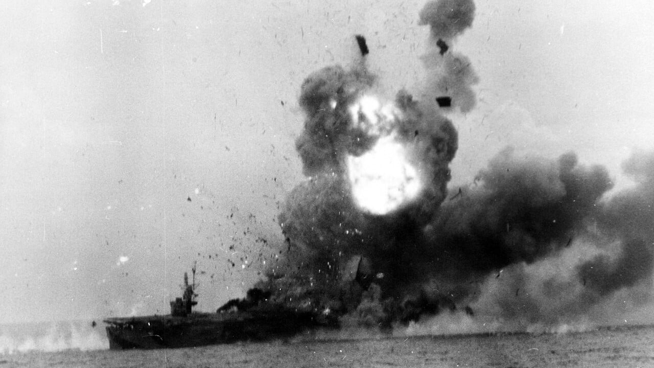 The US Navy escort carrier USS St. Lo erupting in a huge explosion after being hit by a kamikaze off Samar on 25 October 1944