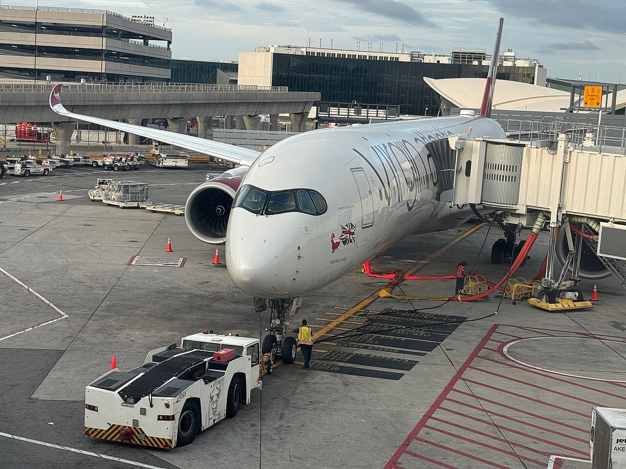 Virgin Atlantic Airbus A350-1000 G-VEVE Fearless Lady at the gate, its nose art visible