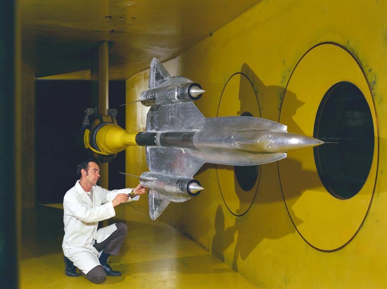 A metal model of the Lockheed YF-12 mounted in a NASA Ames supersonic wind tunnel for an inlet test