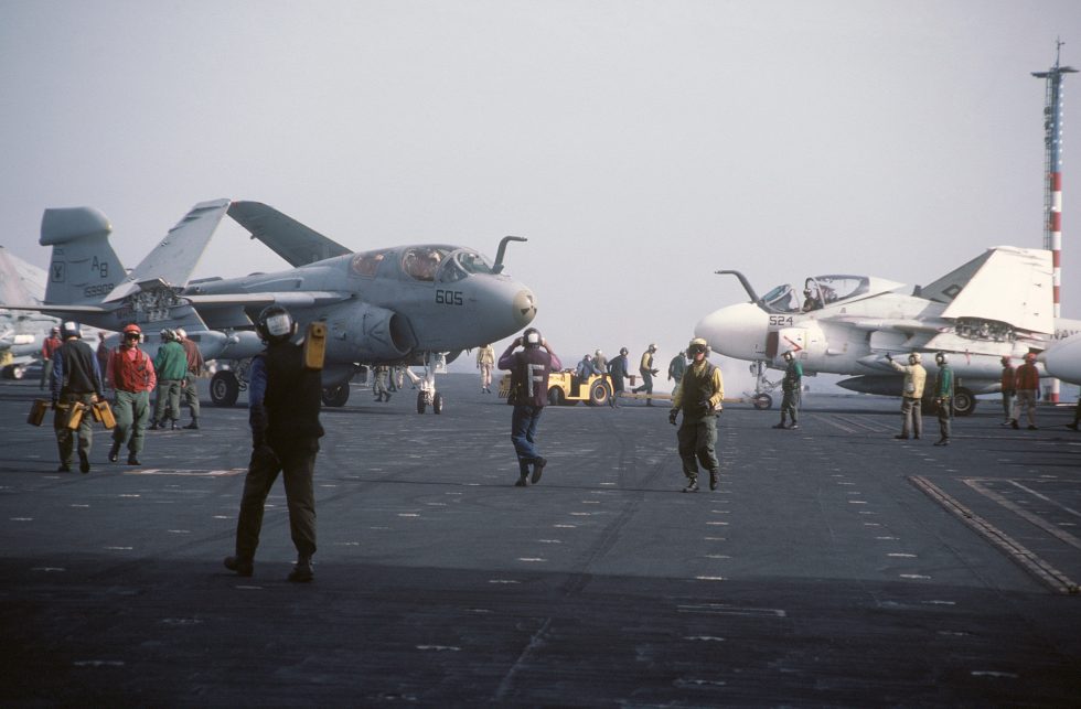 An A-6E Intruder and its EA-6B Prowler cousin aboard USS America.