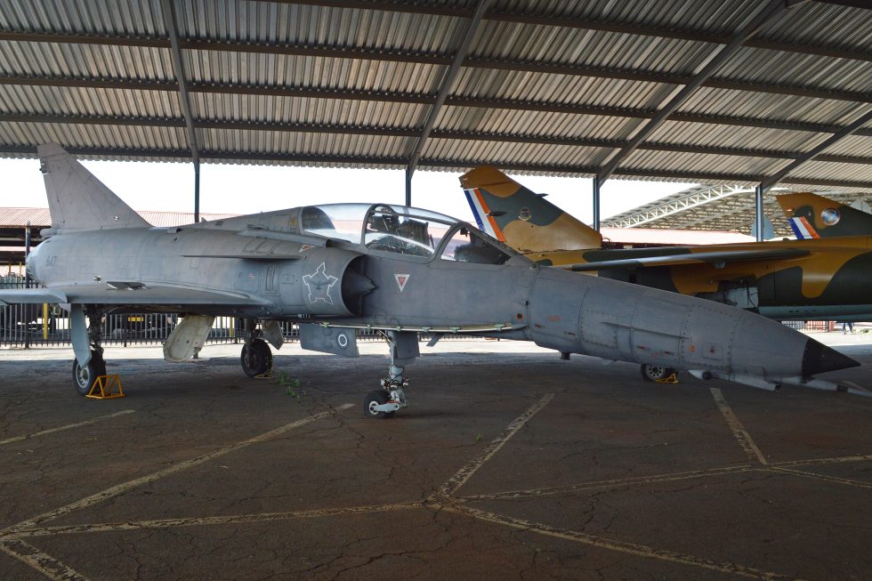 A two-seat Cheetah D preserved under shelter  the variant that outlasted the war it was built for.