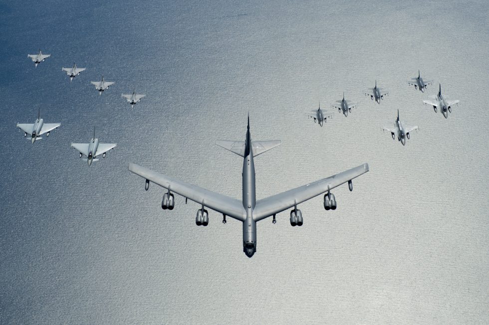 A B-52 leads a formation over the Baltic Sea a deterrence patrol with allied jets.
