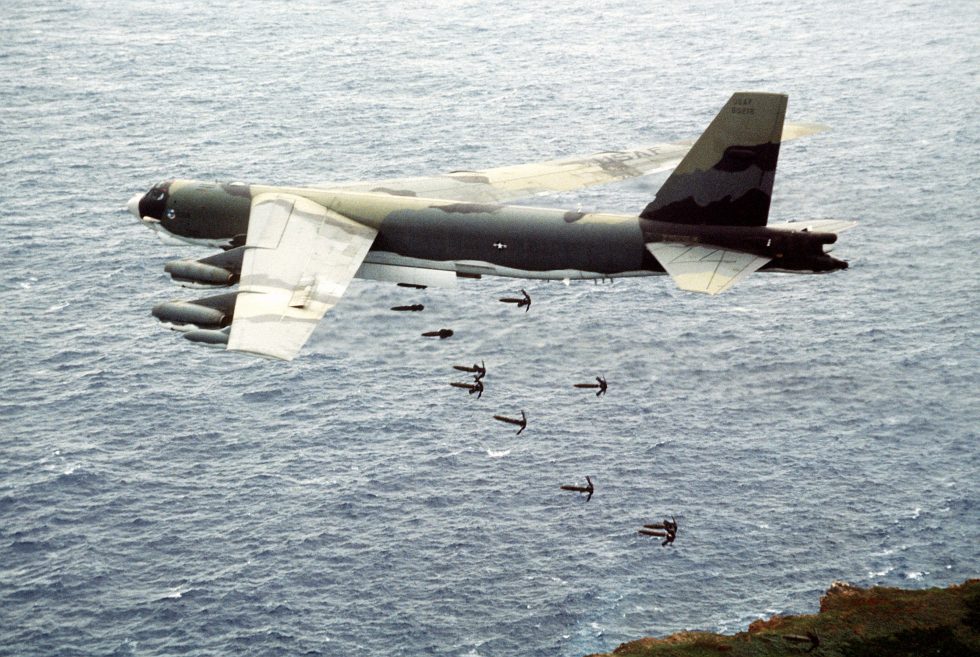 A B-52G unloads a long stick of Mk 82 bombs the conventional carpet-bombing mission.