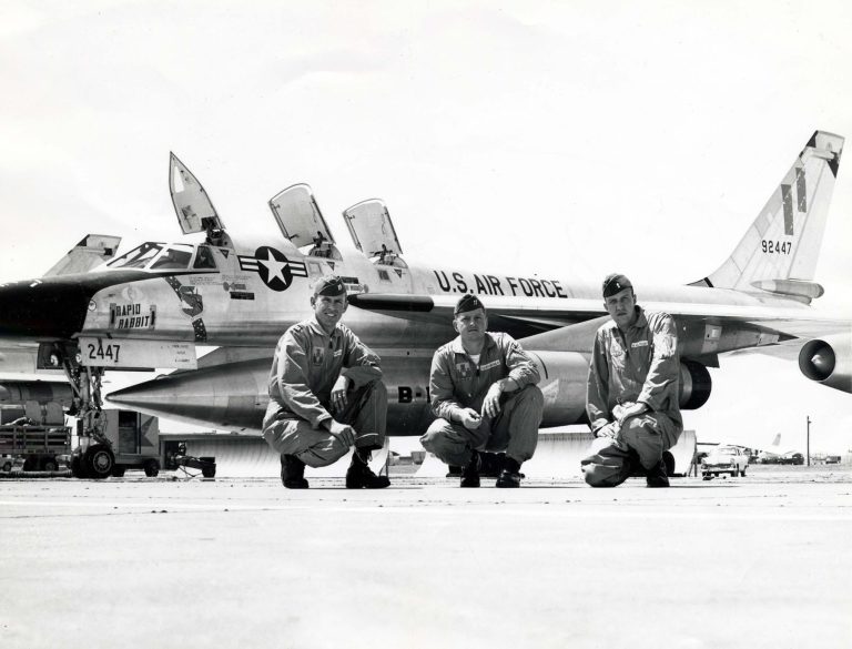 A three-man B-58 flight crew in front of their aircraft, 59-2447 Rapid Rabbit.