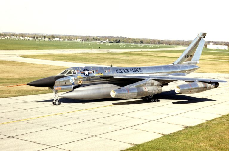 A B-58A Hustler in flight carrying its centreline fuel-and-weapon pod.