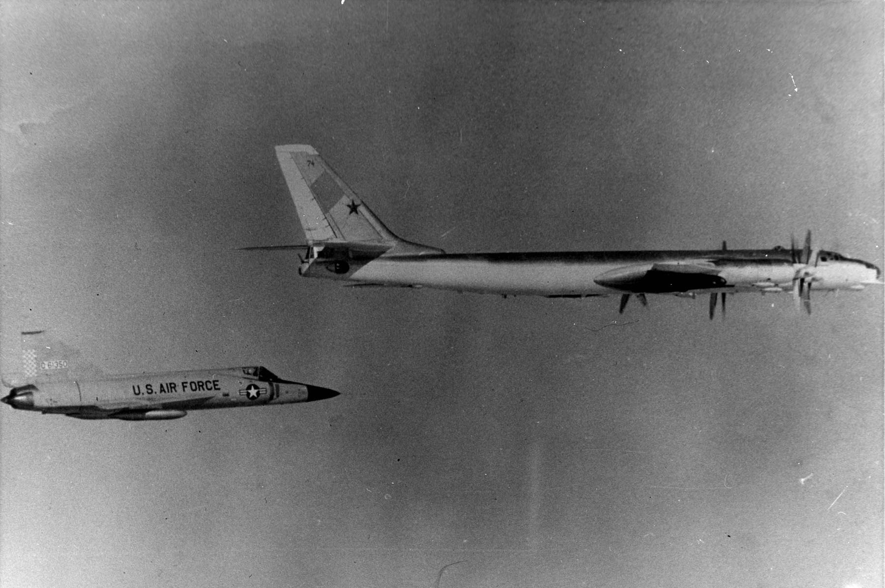 Convair F-102A Delta Dagger interceptor shadowing a Soviet bomber