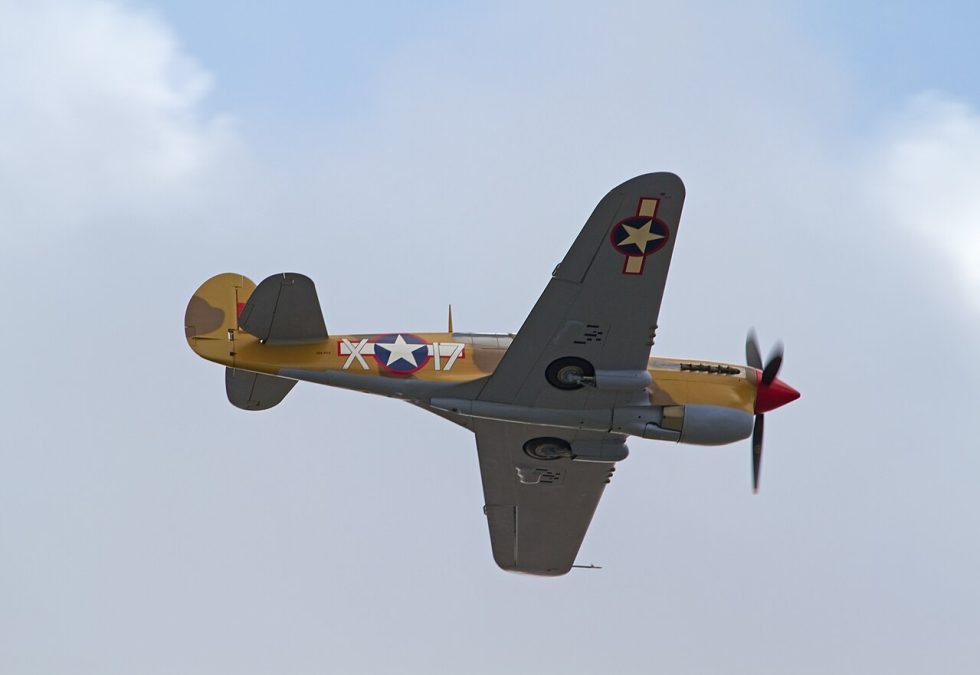 A P-40 Warhawk in flight, its lines little changed from the P-36 Hawk it grew out of.