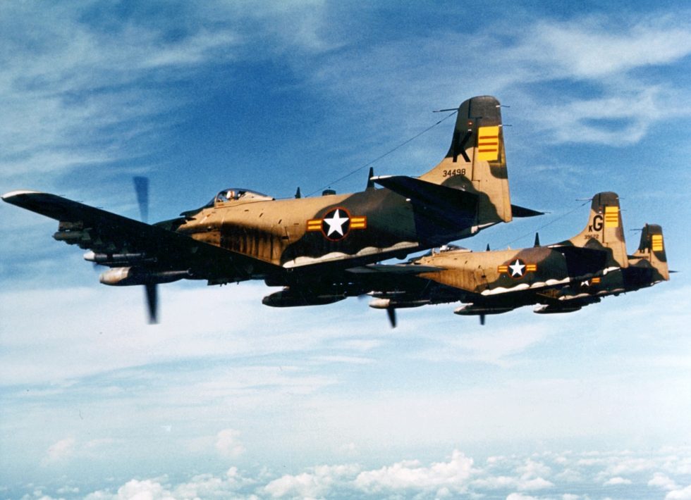 A Skyraider in South Vietnamese markings, armed and in flight  the flying dump truck at work.