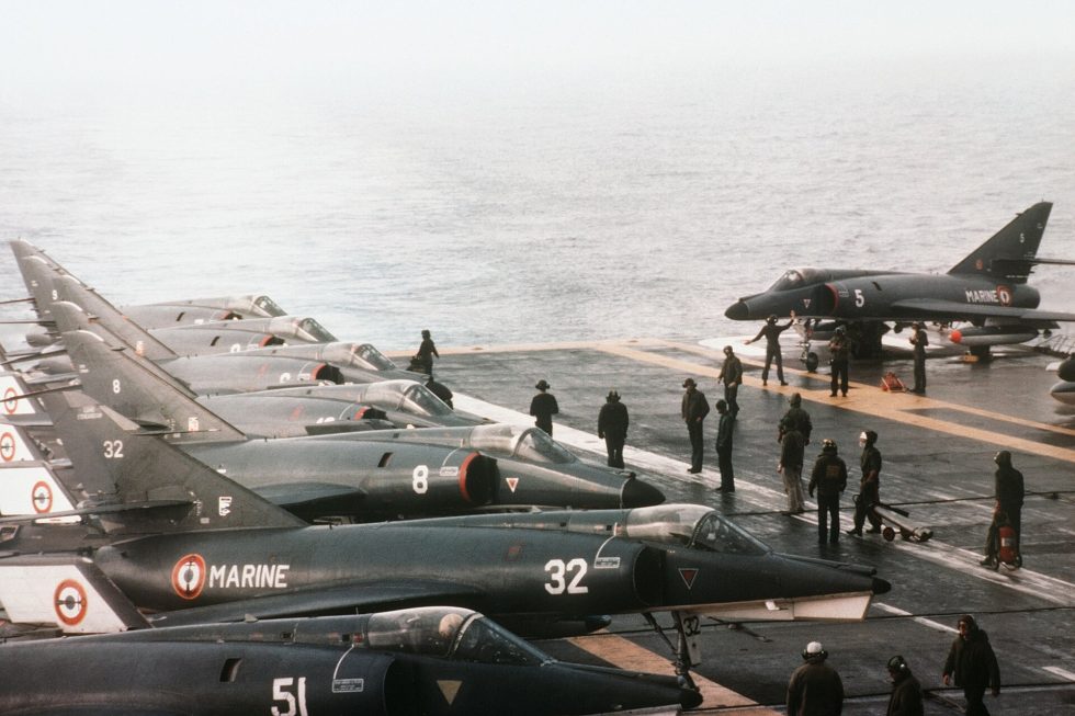 An Étendard IVM beside a Super Étendard on the deck of the carrier Foch, 1983  parent and successor together.
