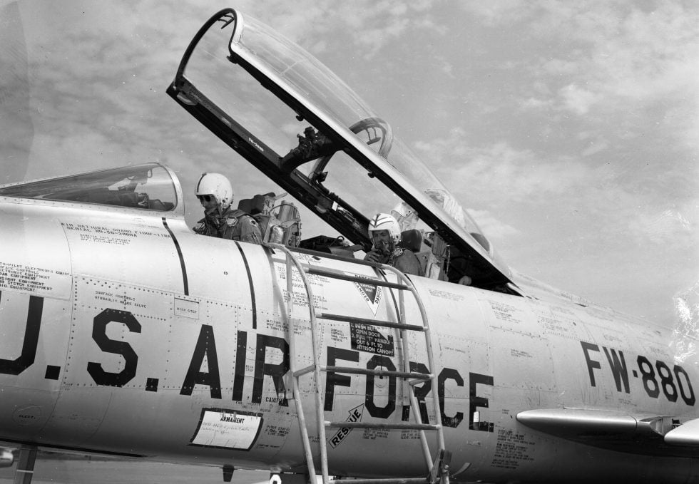 A two-seat F-100F with its canopy open  the variant behind the Misty and Wild Weasel missions.