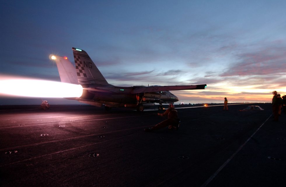 An F-14 Tomcat in full afterburner  two turbofans lit.
