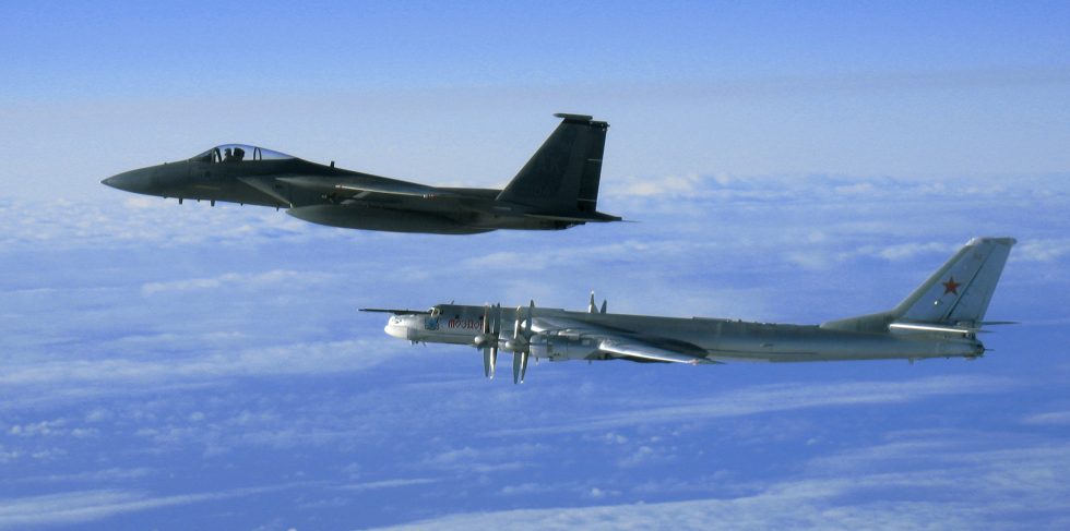 A US Air Force F-15C escorts a Russian Tu-95MS off Alaska in 2006 the Cold War intercept ritual, still recurring.