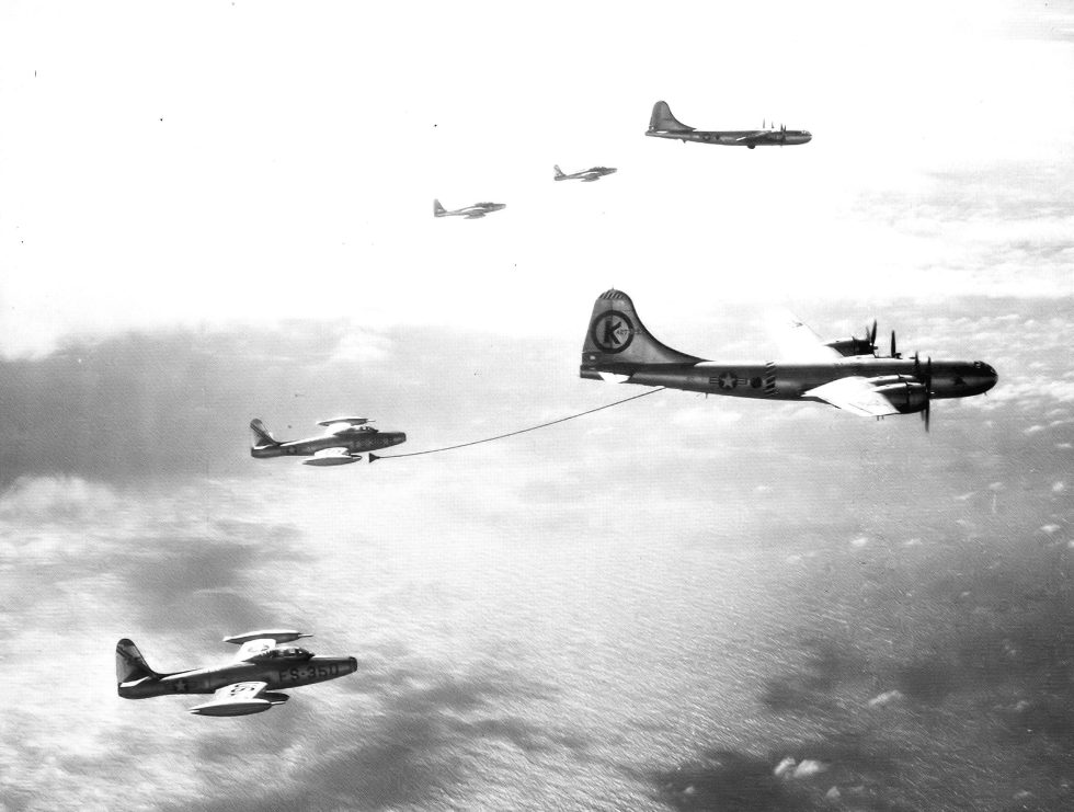 An F-84 takes on fuel from a KB-29 tanker the capability that made record crossings possible.