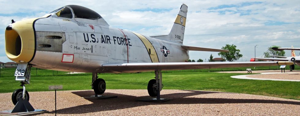 A preserved North American F-86H on museum display, showing the swept-wing planform.