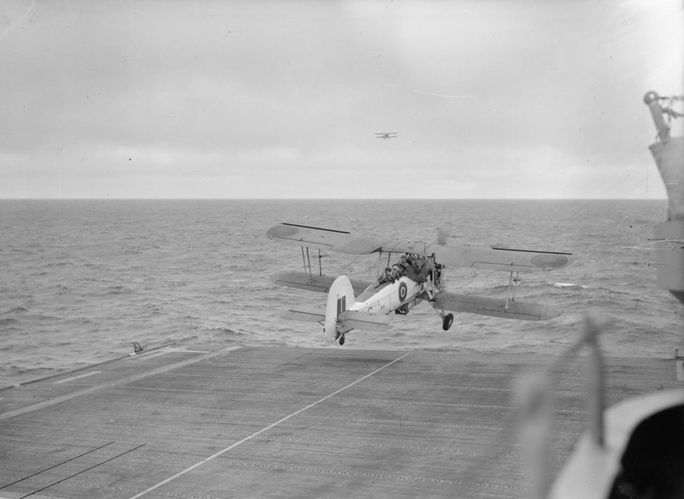 A Swordfish lifts off from the deck of the escort carrier HMS Striker.