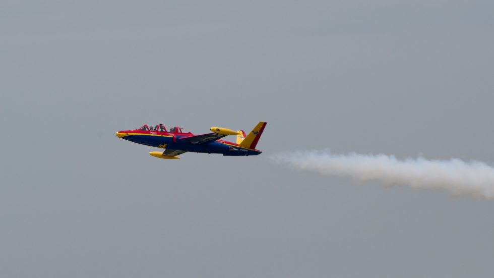 A Fouga Magister in flight  the butterfly V-tail unmistakable against the sky.