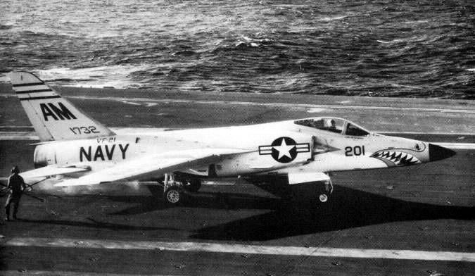 A VF-21 Tiger spotted aboard USS Ranger (CVA-61), 1957  folded, thin wings clear the crowded deck.
