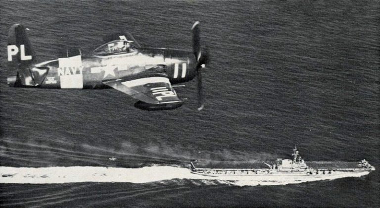 A US Navy F8F-2P Bearcat banking over the carrier USS Midway, 1952.