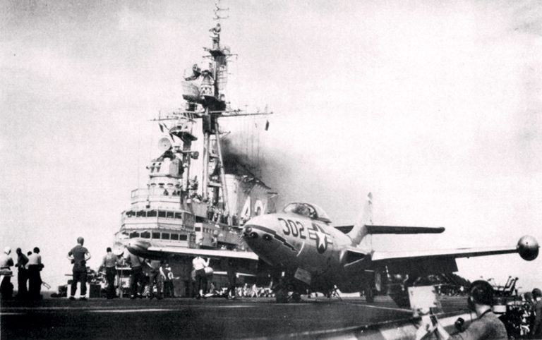 A VF-83 F9F-5 Panther hooked to the catapult of USS Coral Sea, 1953.