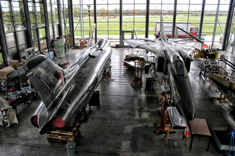 A Marut airframe in bare metal beside a MiG-23  the clean, area-ruled lines on show.