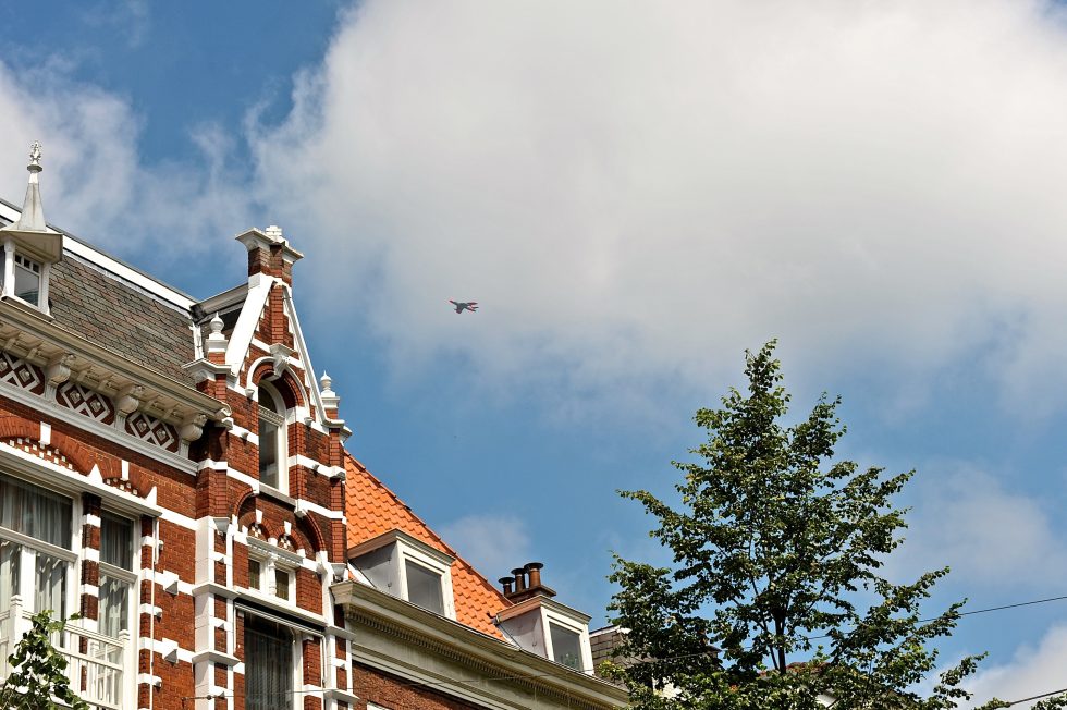 A preserved Hawker Hunter in a commemorative flypast.