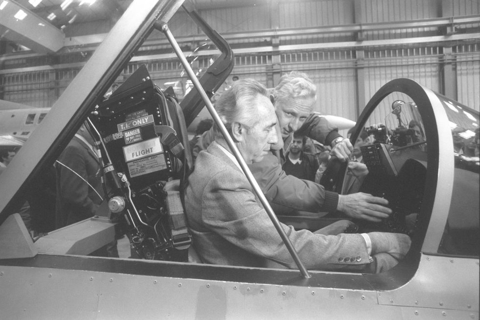 Israeli Prime Minister Shimon Peres in a Lavi cockpit  a fighter that carried enormous national prestige.