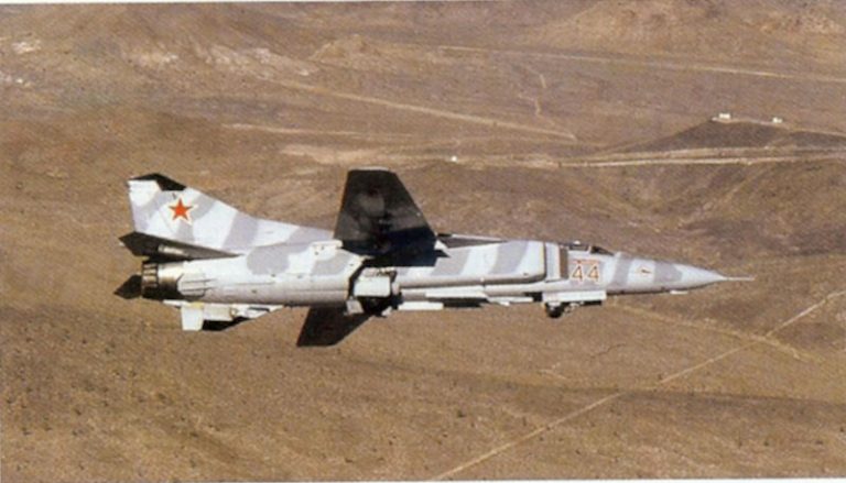 A MiG-23 Flogger airborne with its wings swept  the types defining variable-geometry profile.