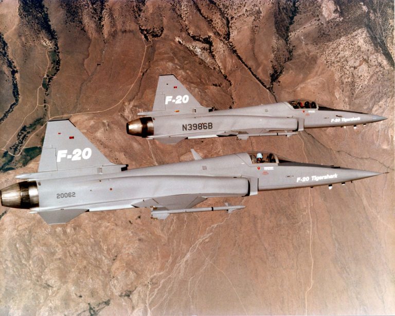 Two of the three F-20 prototypes (82-0062 and N3986B) flying in formation both were later lost in fatal demonstration crashes.