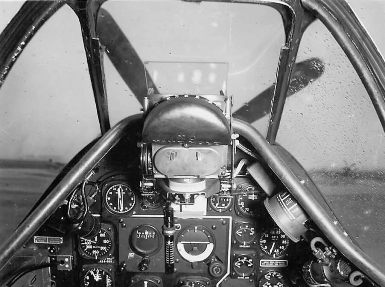 The P-51D cockpit: gunsight, throttle quadrant and the classic Mustang instrument panel.