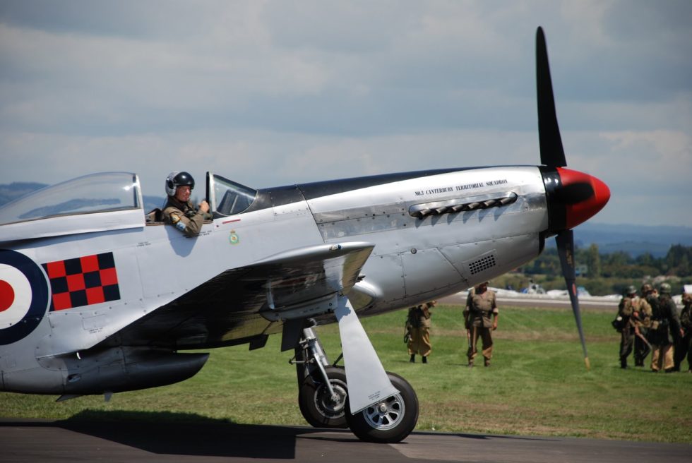 A preserved P-51D Mustang warbird in classic bare-metal finish  the type most people picture as a WWII fighter.