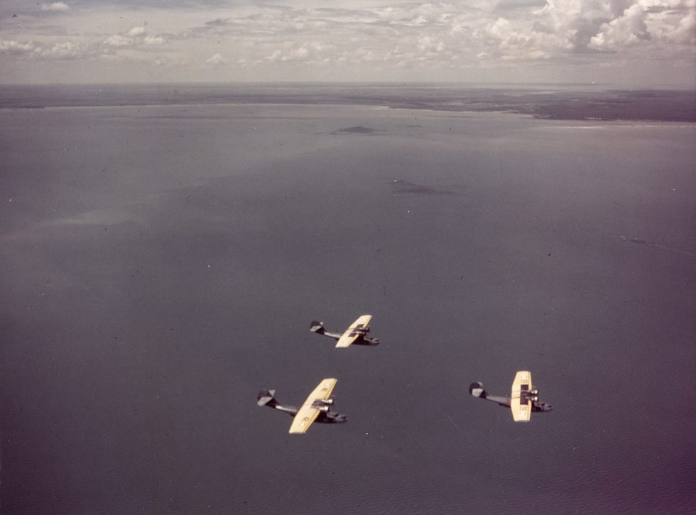 PBY-3 Catalina patrol planes flying in formation before the war.