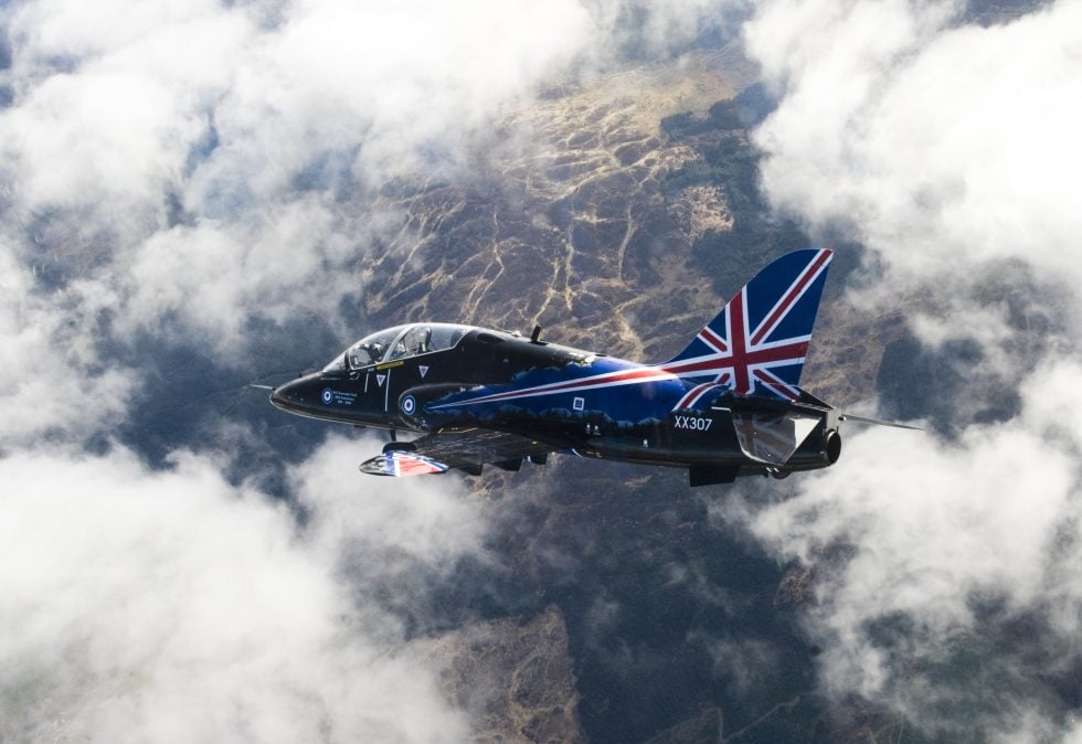 An RAF Hawk T1 high above RAF Valley, the home of British advanced flying training.