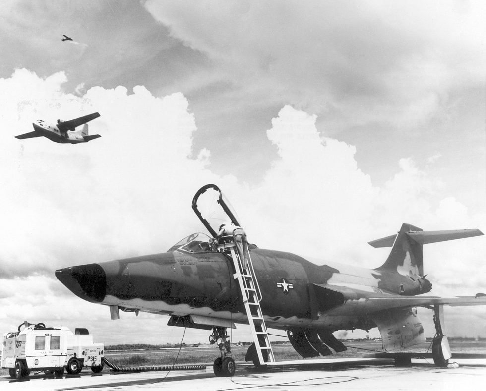Technicians prepare an RF-101 Voodoo on the flight line  the camera-nosed Long Bird reconnaissance jet.