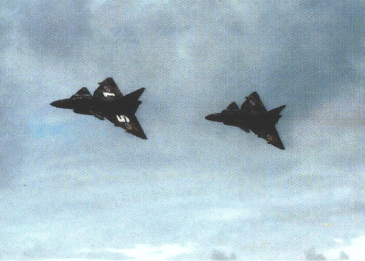 Swedish Saab 37 Viggen fighters flying in formation over the Baltic Sea