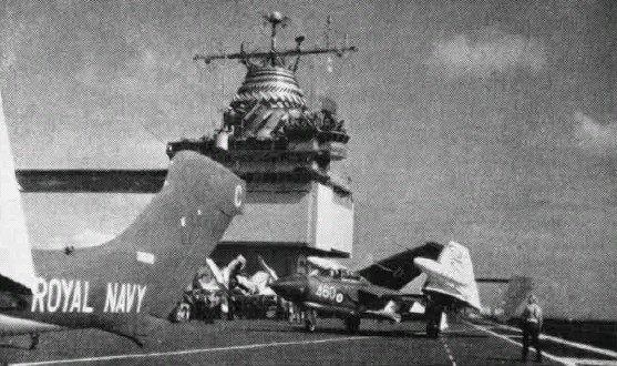 Sea Vixens from HMS Centaur ranged on the deck of USS Enterprise, 1962.