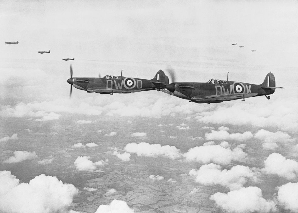 Spitfire Mk Is of No. 610 Squadron in vic formation over Kent, 24 July 1940.