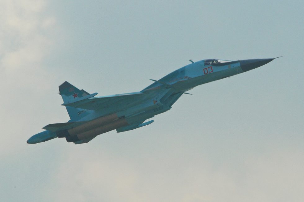 A Su-34 flypast showing the broad duckbill nose that houses the two-seat cockpit.
