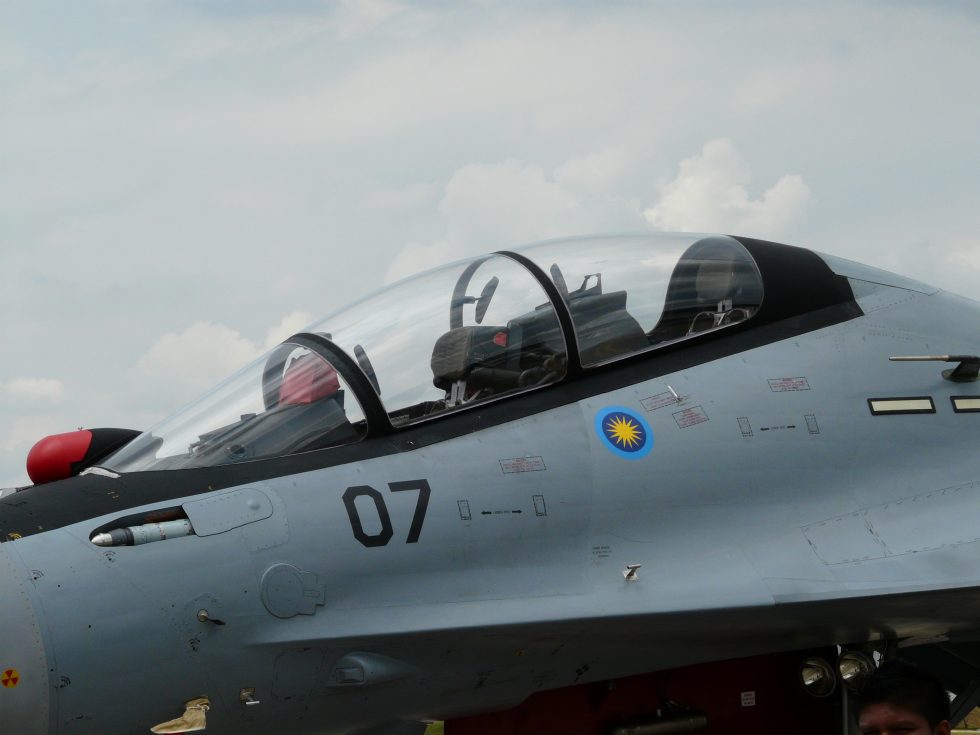 The Su-30s two-seat cockpit a pilot up front, a weapons officer behind.
