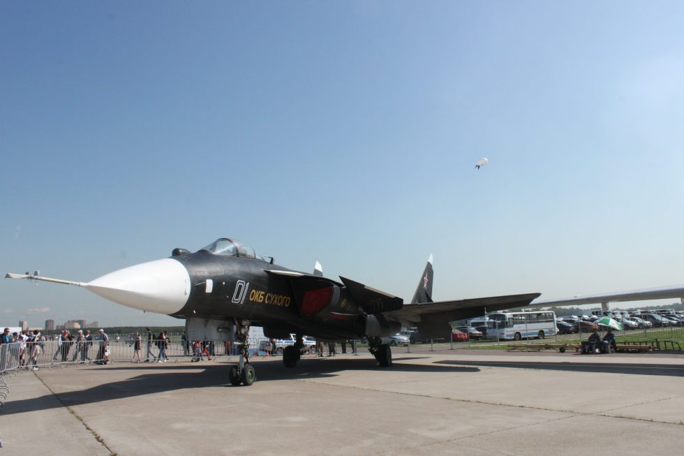 Front three-quarter view: the long nose probe and the forward-swept wings sweeping toward the camera.