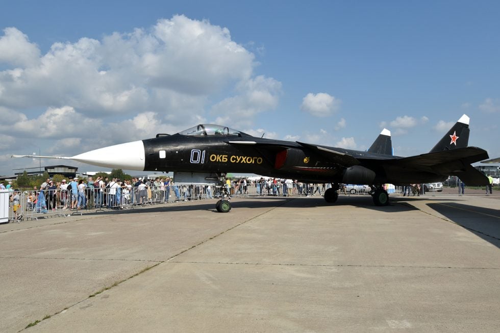 A clean side-on view of the sole Su-47 on the ground  canards, forward-swept wing and twin tails in one line.