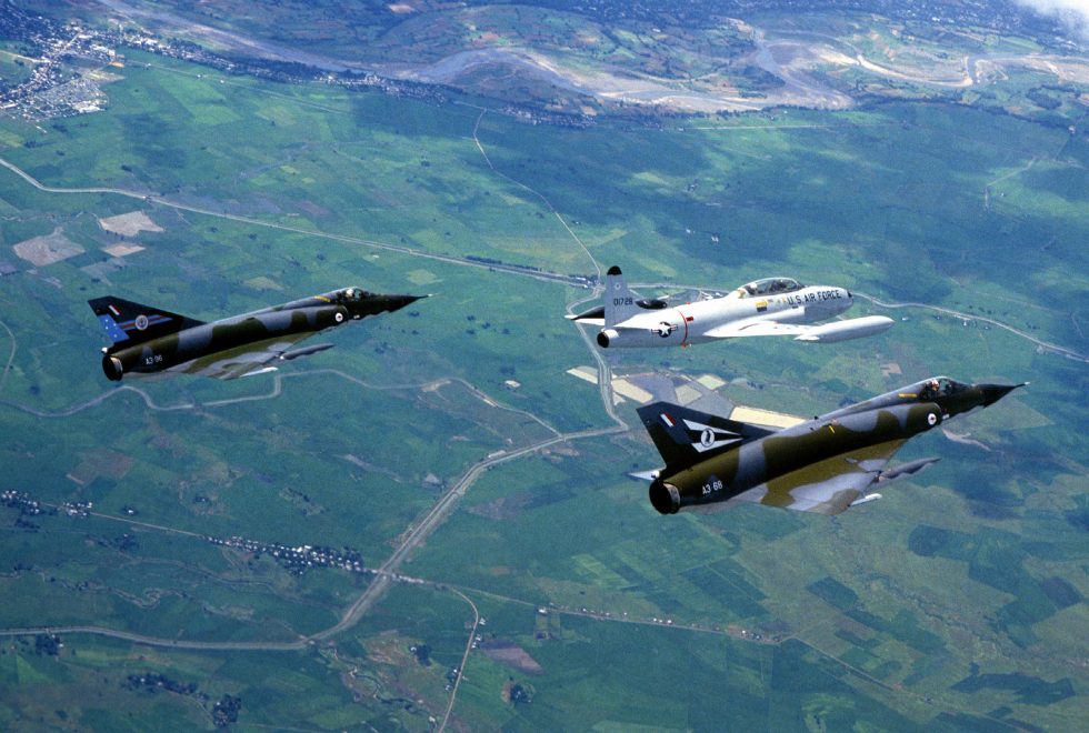 A T-33 formates with two Royal Australian Air Force Mirages, 1981 the T-Bird served allied air arms worldwide.